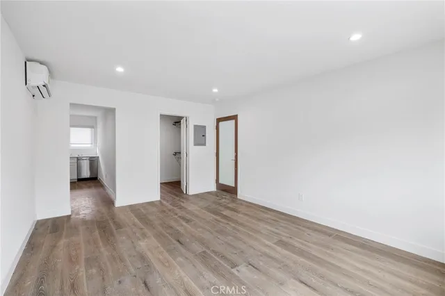 a view of a kitchen center island with wooden floor