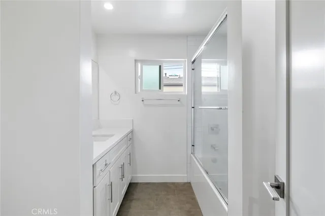 a kitchen with a refrigerator stove and sink