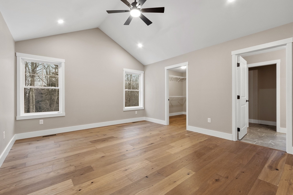 29 High Range Drive New Ipswich, NH 03071 - Photo 26 of 36 a view of an empty room with a window and wooden floor