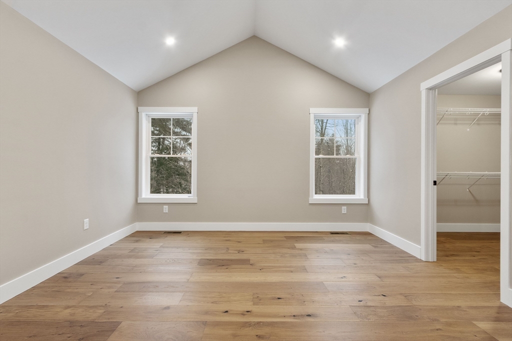 29 High Range Drive New Ipswich, NH 03071 - Photo 28 of 36 a view of an empty room with wooden floor and a window