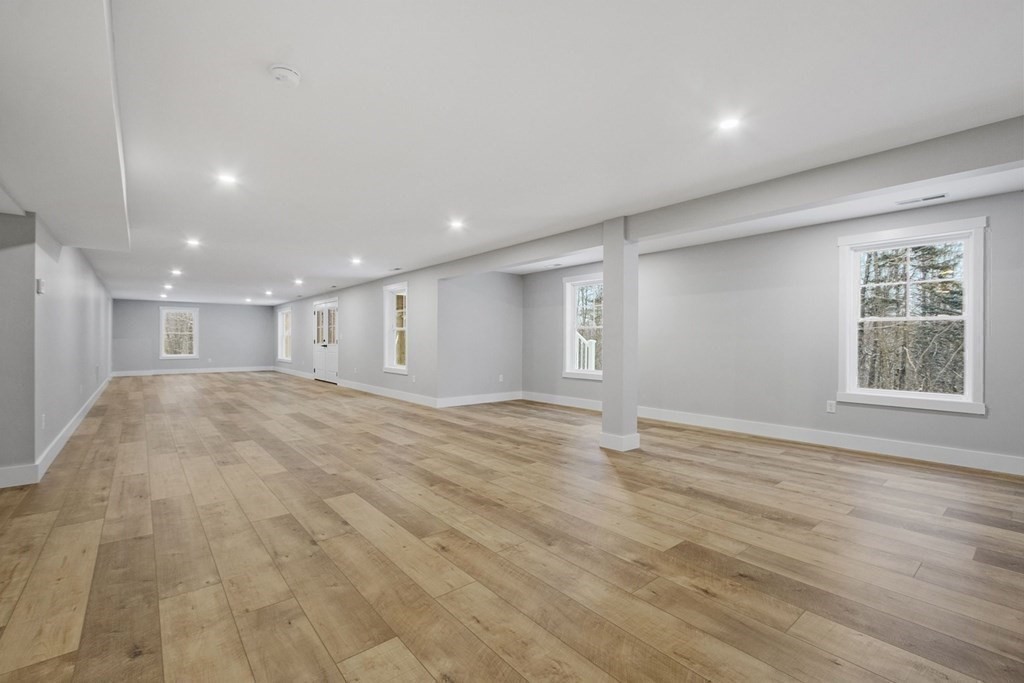29 High Range Drive New Ipswich, NH 03071 - Photo 34 of 36 a view of an empty room with wooden floor and a window