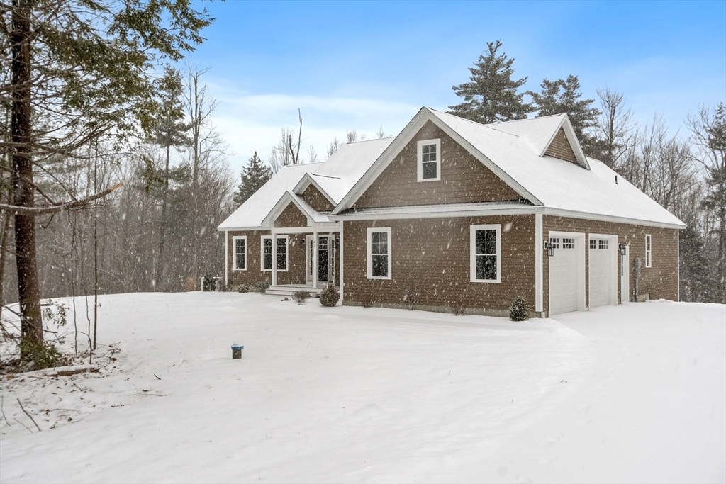 29 High Range Drive New Ipswich, NH 03071 - Photo 6 of 36 a front view of a house with a yard covered in snow