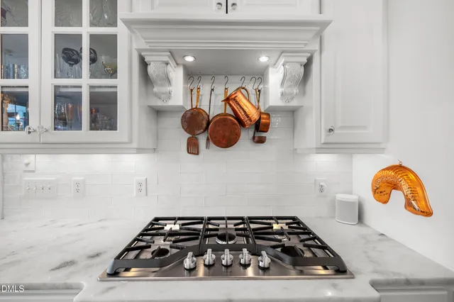 a bathroom with a granite countertop sink mirror and bathtub