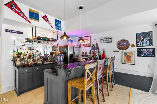 an aerial view of a house with garden space and street view