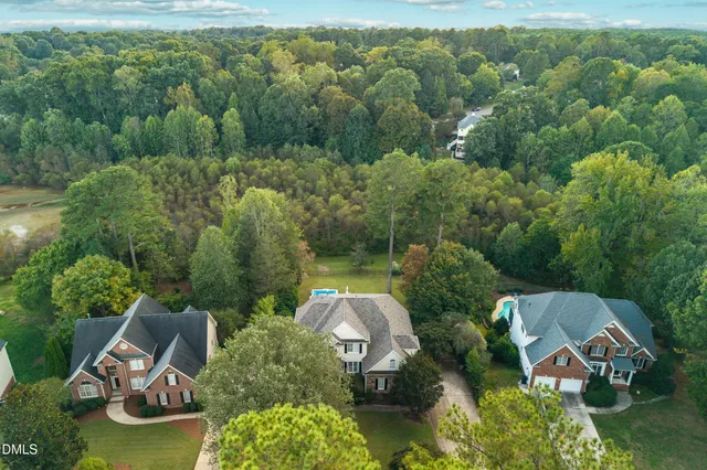 a view of a hallway with entryway wooden floor and front door