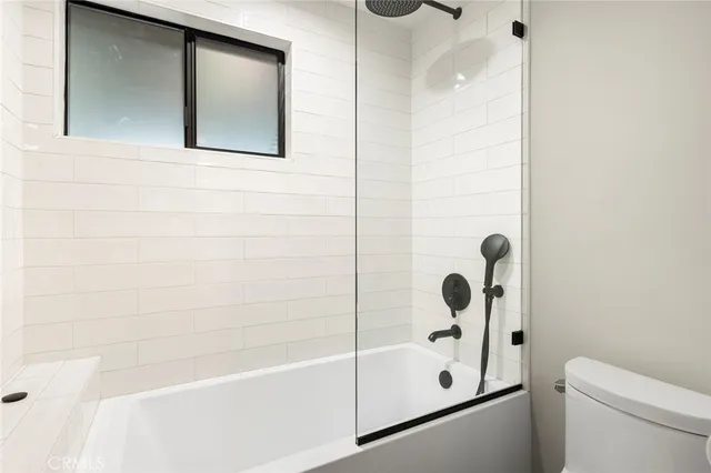 a utility room with closet dryer and washer