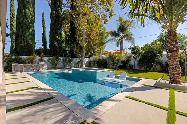 a view of a backyard with sitting area