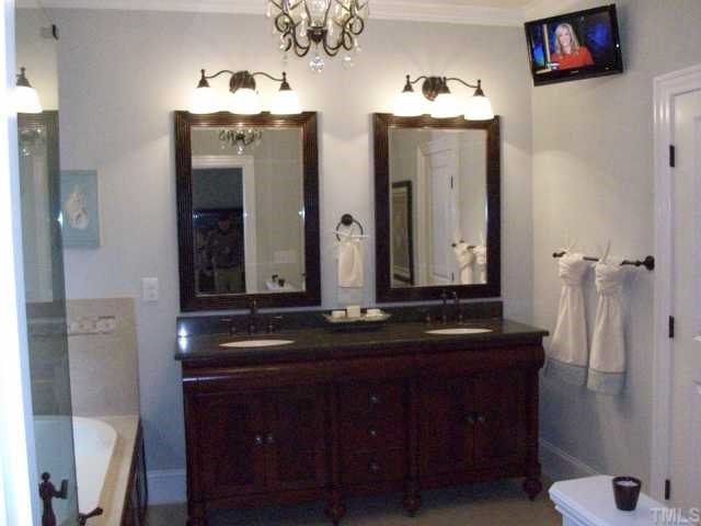 2630 Davis Street Raleigh, NC 27608 - Photo 10 of 12 Yes, you are correct, that is a TV in the master bathroom. There is also an air jet tub with a heated seatback as well as a oversized heavy frameless shower! (Psst...hey guys, you can see the TV from the toilet!)