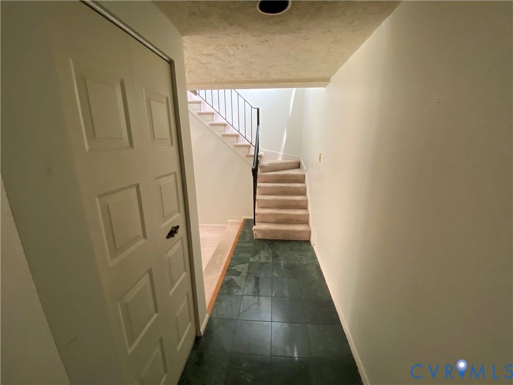 1507 Bronwyn Road, Unit 301 Henrico, VA 23238 - Photo 22 of 41 a view of a hallway with wooden floor and staircase