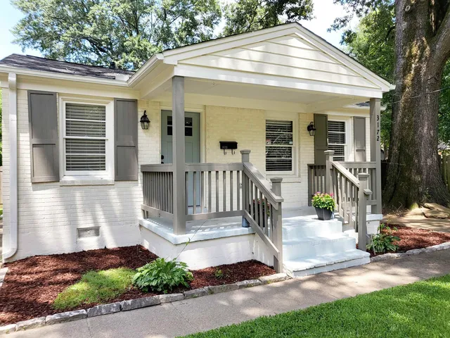 a front view of a house with a porch