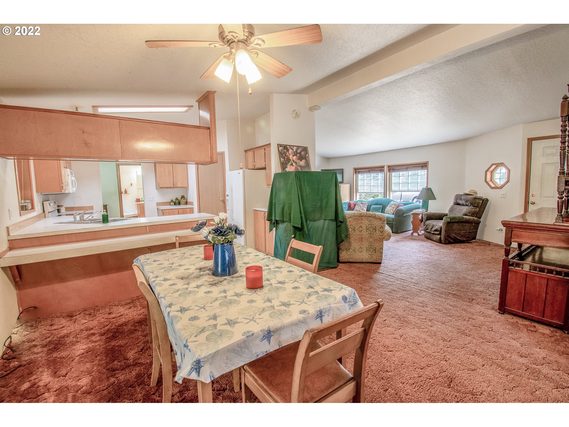38435 Row River Road Dorena, OR 97434 - Photo 13 of 32 a living room with furniture a large window and a table