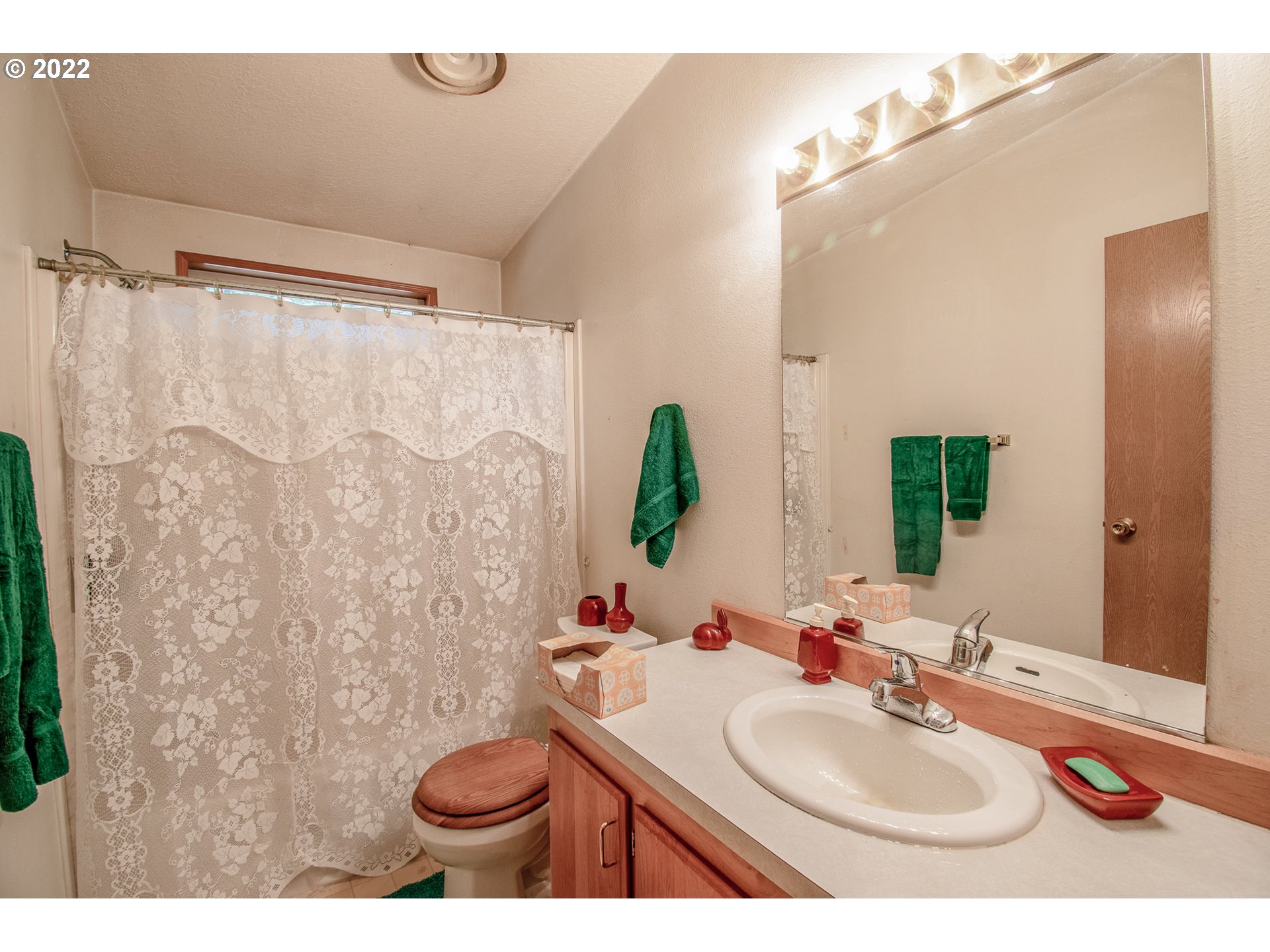 38435 Row River Road Dorena, OR 97434 - Photo 16 of 32 a bathroom with a sink and a mirror