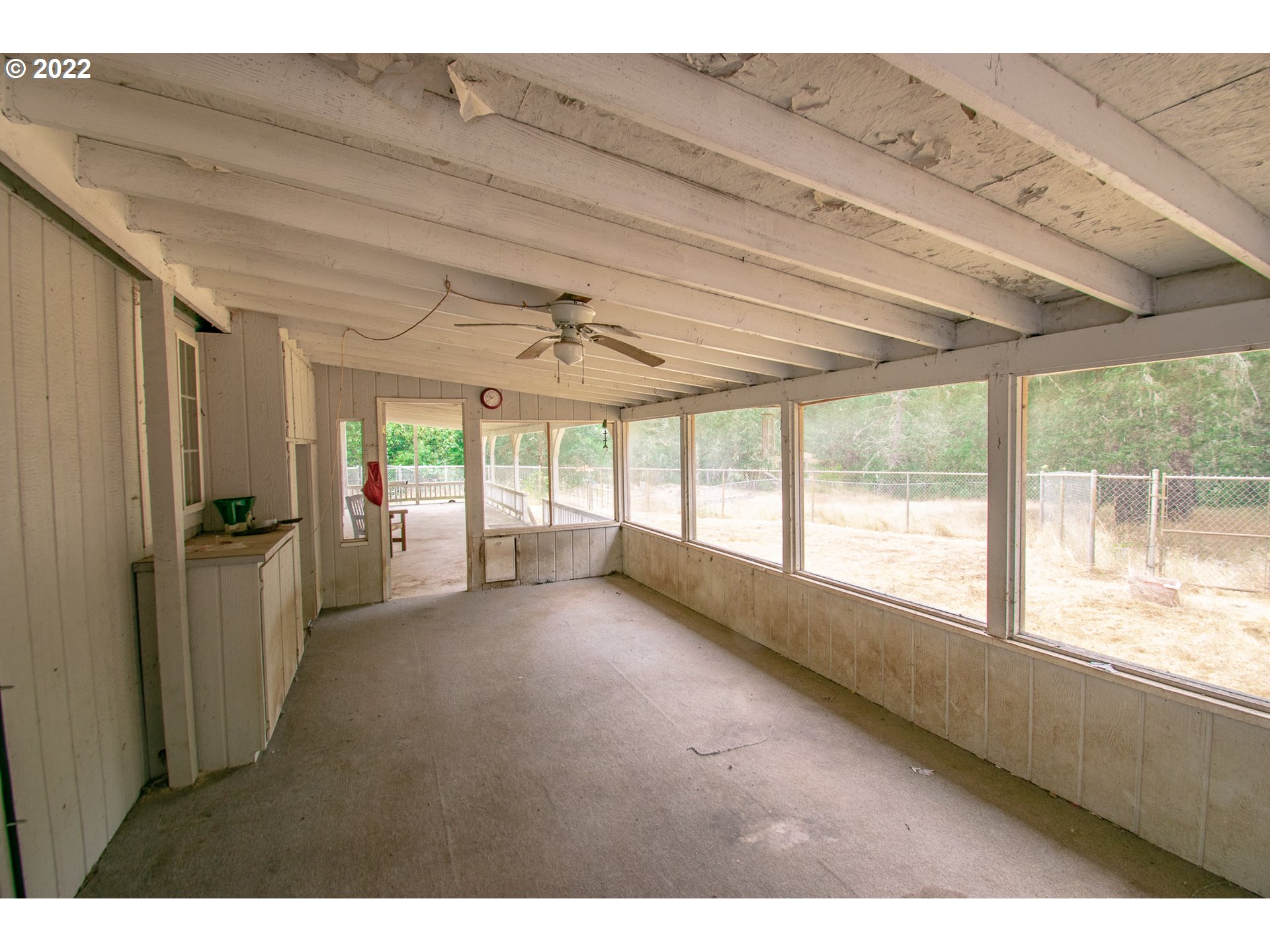 38435 Row River Road Dorena, OR 97434 - Photo 18 of 32 a view of an empty room with a window