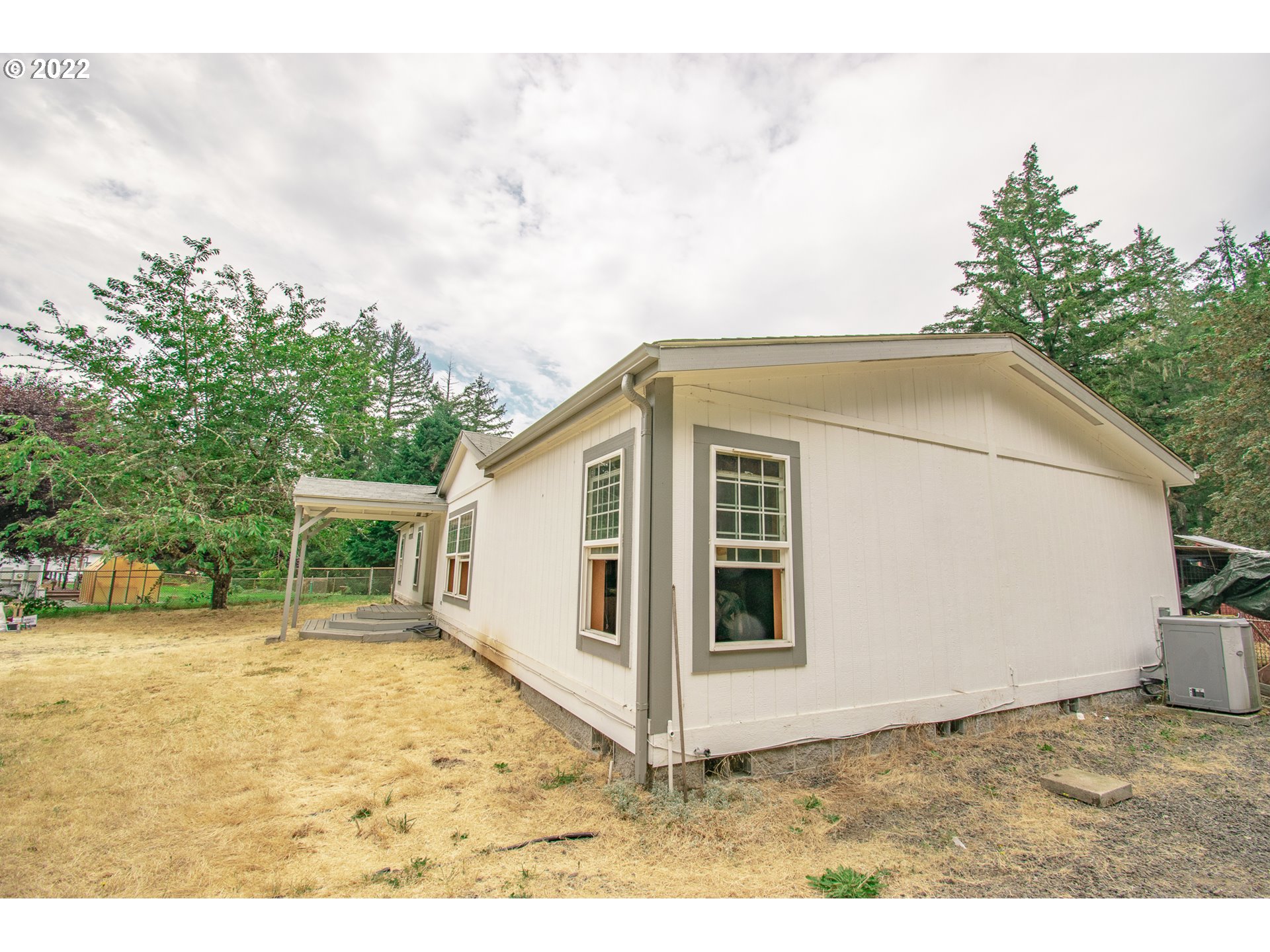 38435 Row River Road Dorena, OR 97434 - Photo 5 of 32 a view of a backyard of the house
