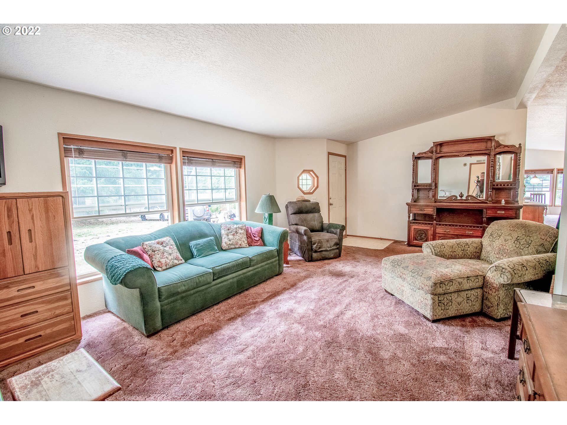 38435 Row River Road Dorena, OR 97434 - Photo 6 of 32 a living room with furniture and a large window