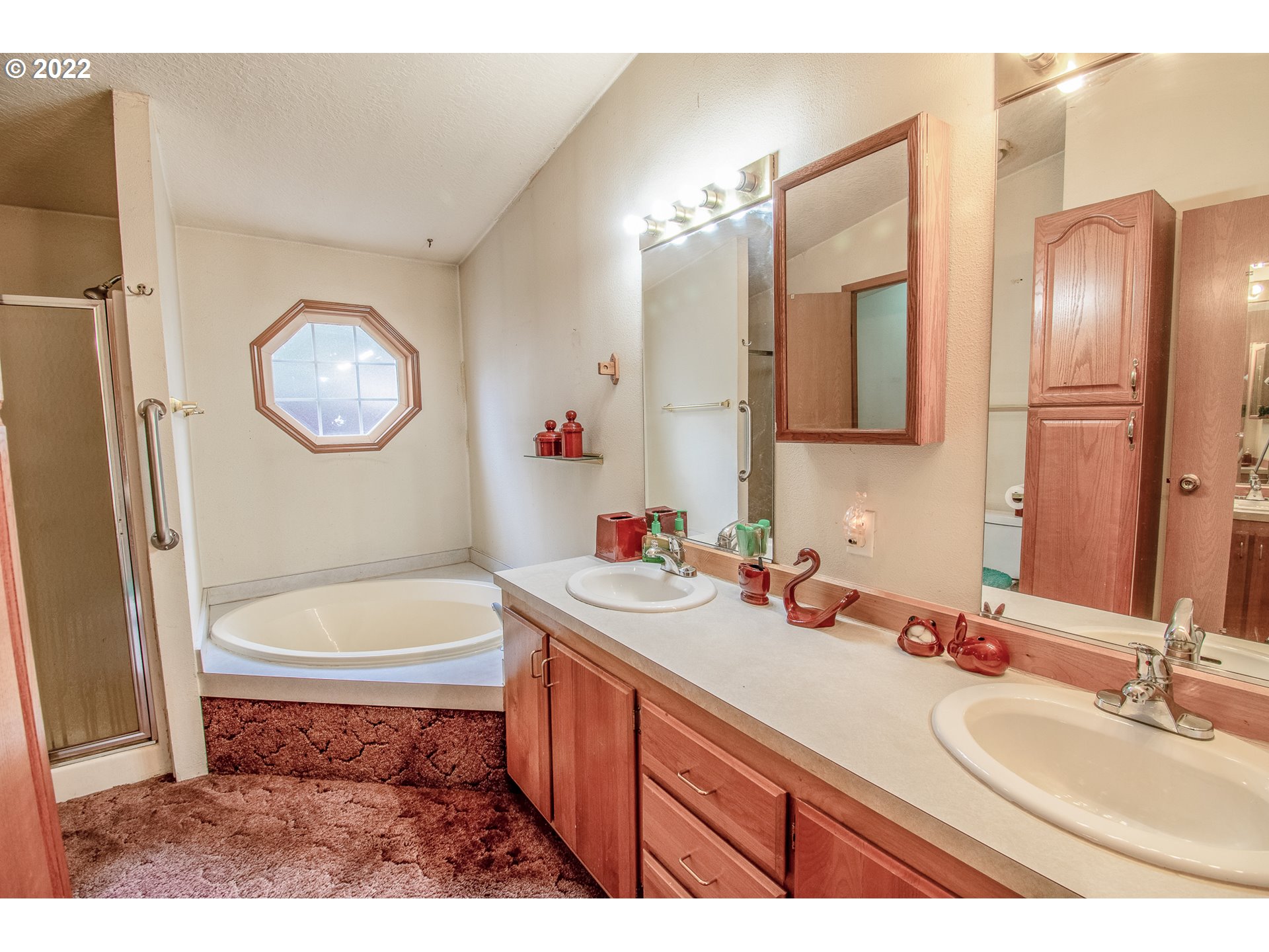 38435 Row River Road Dorena, OR 97434 - Photo 10 of 32 a bathroom with a sink a toilet and bathtub