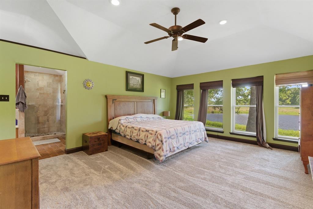 321 Cr 211 Road Gainesville, TX 76240 - Photo 16 of 40 Primary bedroom overlooking the back pond.