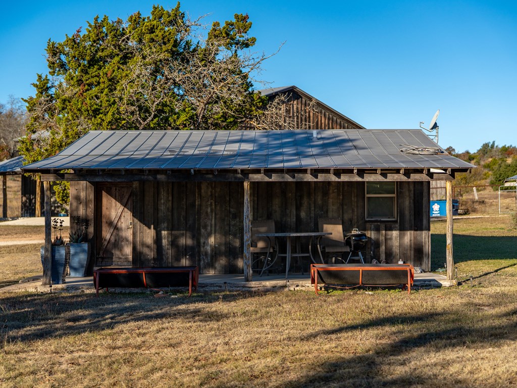 196 Hermit Hill Road Fredericksburg, TX 78624 - Photo 15 of 49 a view of a house with backyard tub and porch