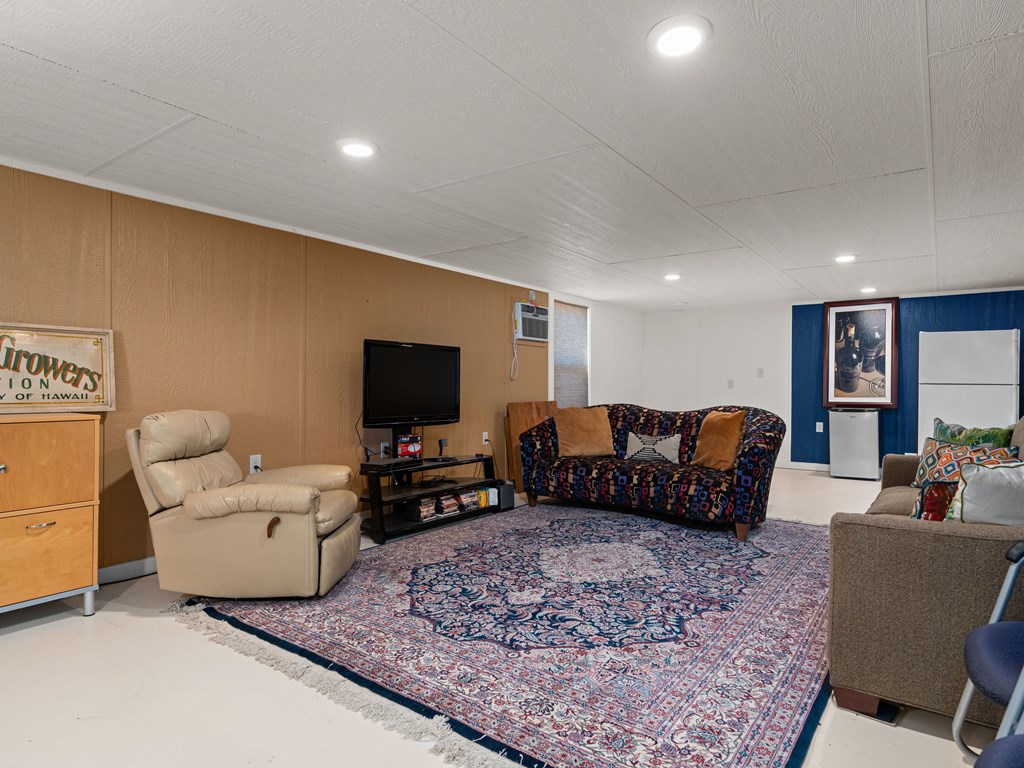196 Hermit Hill Road Fredericksburg, TX 78624 - Photo 25 of 49 a living room with furniture and a flat screen tv