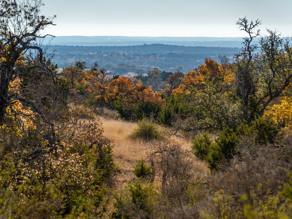 196 Hermit Hill Road Fredericksburg, TX 78624 - Photo 29 of 49 a view of a lake with mountains in the background