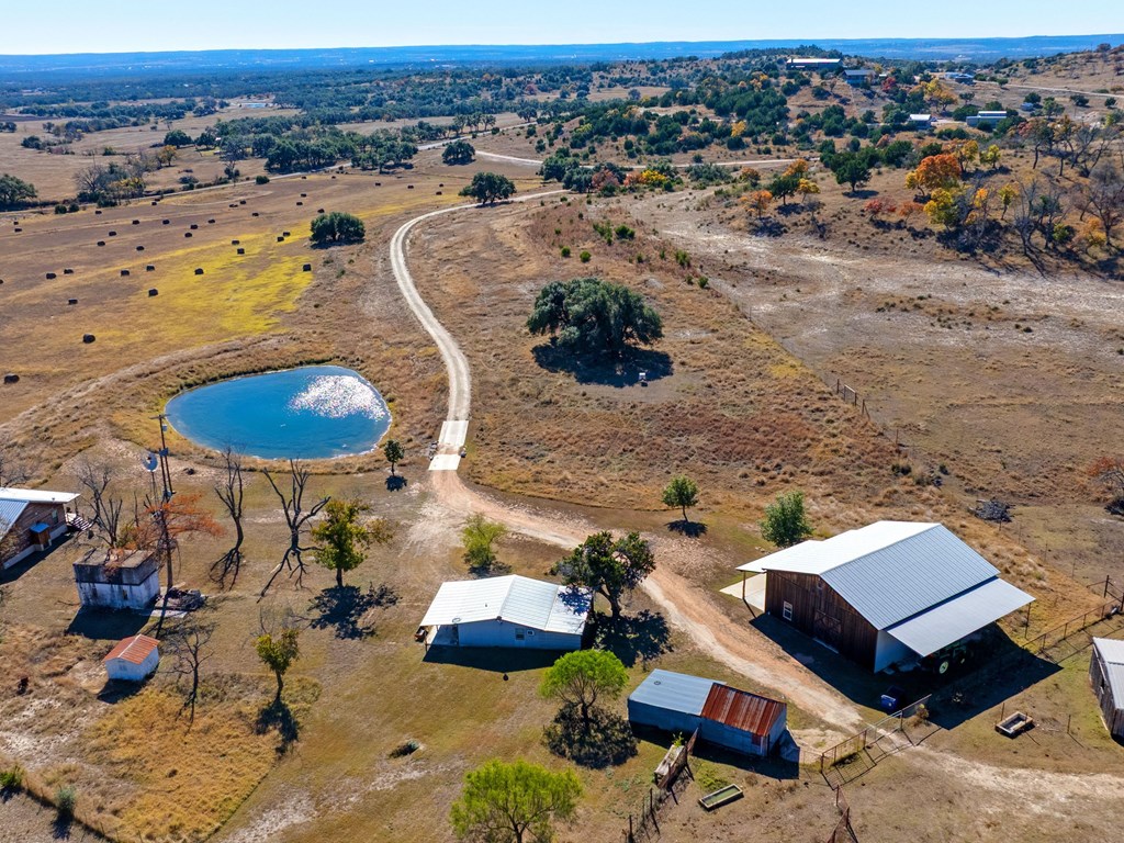 196 Hermit Hill Road Fredericksburg, TX 78624 - Photo 31 of 49 an aerial view of a house with a backyard space and ocean view