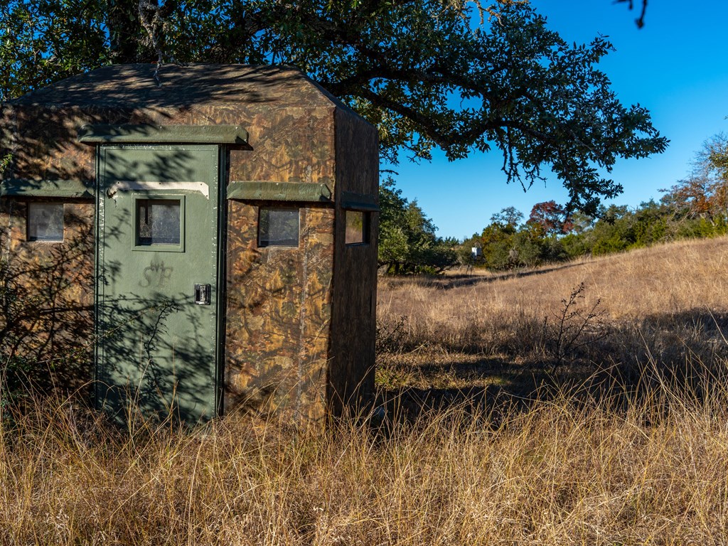196 Hermit Hill Road Fredericksburg, TX 78624 - Photo 34 of 49 a view of a house with a yard