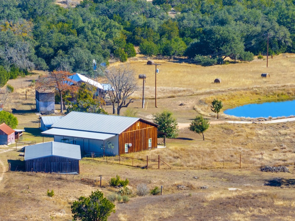 196 Hermit Hill Road Fredericksburg, TX 78624 - Photo 40 of 49 a view of a house with a yard covered with snow
