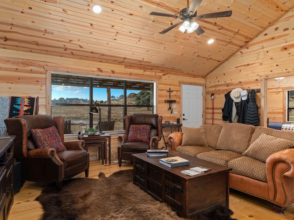 196 Hermit Hill Road Fredericksburg, TX 78624 - Photo 4 of 49 a living room with furniture and a large window
