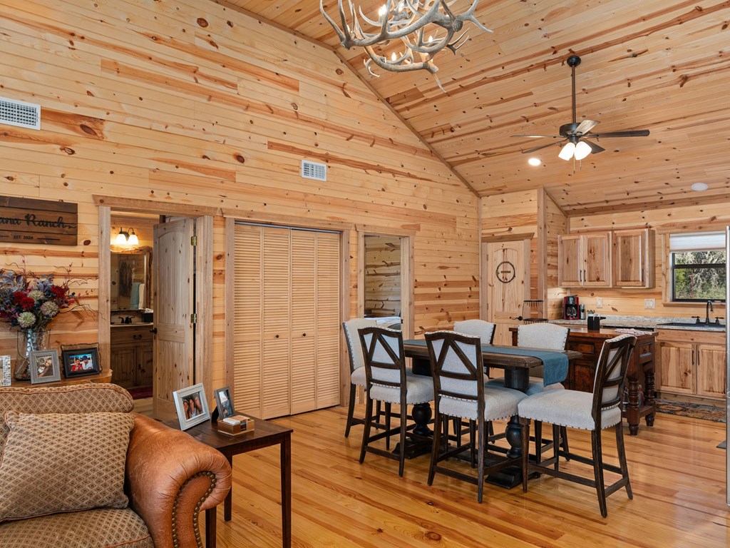 196 Hermit Hill Road Fredericksburg, TX 78624 - Photo 8 of 49 a view of a dining room with furniture window and wooden floor