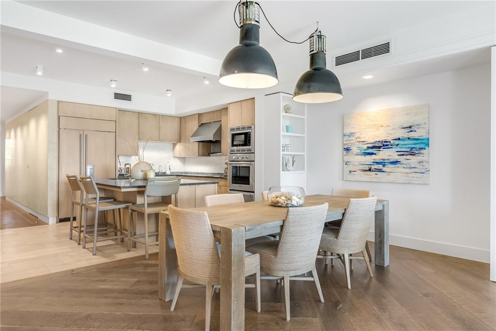 850 Beach Road, Unit 176 Indian River Shores, FL 32963 - Photo 1 of 18 a dining room with furniture and a chandelier