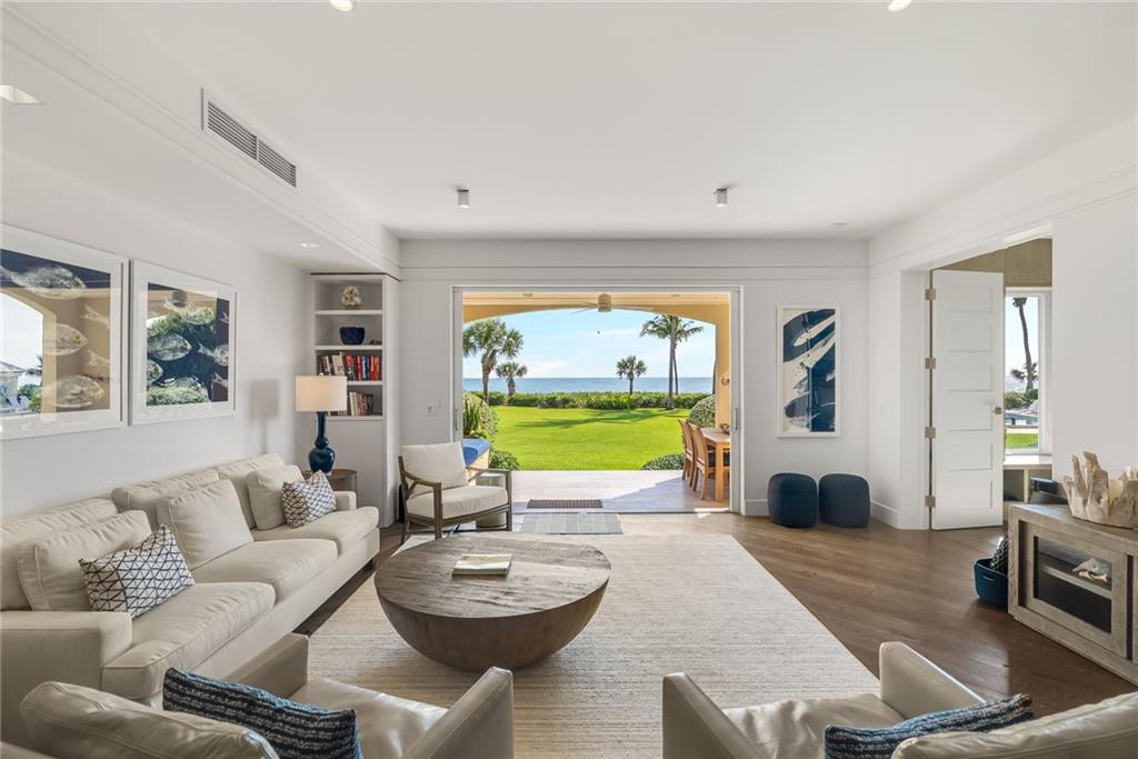 850 Beach Road, Unit 176 Indian River Shores, FL 32963 - Photo 2 of 18 a living room with furniture and a large window