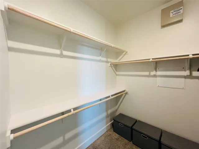 a room with linen closet and wooden floor