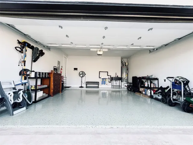a living room with lots of furniture and gym equipment