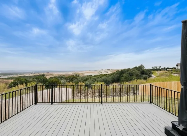 a view of a balcony with wooden floor