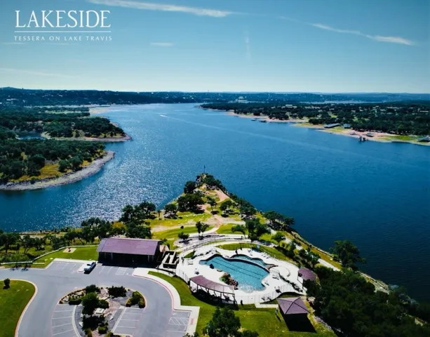 an aerial view of a house with a ocean view