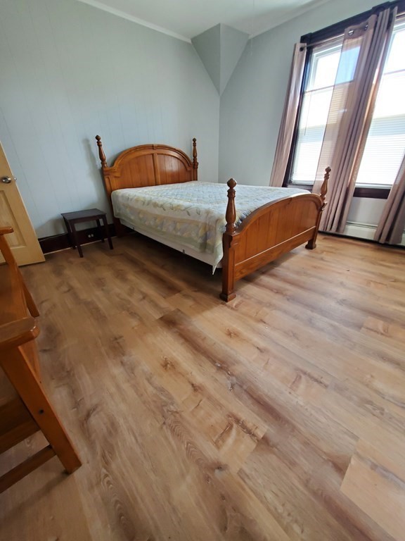 20 Baker Street Gardner, MA 01440 - Photo 12 of 15 a bedroom with a bed and a window