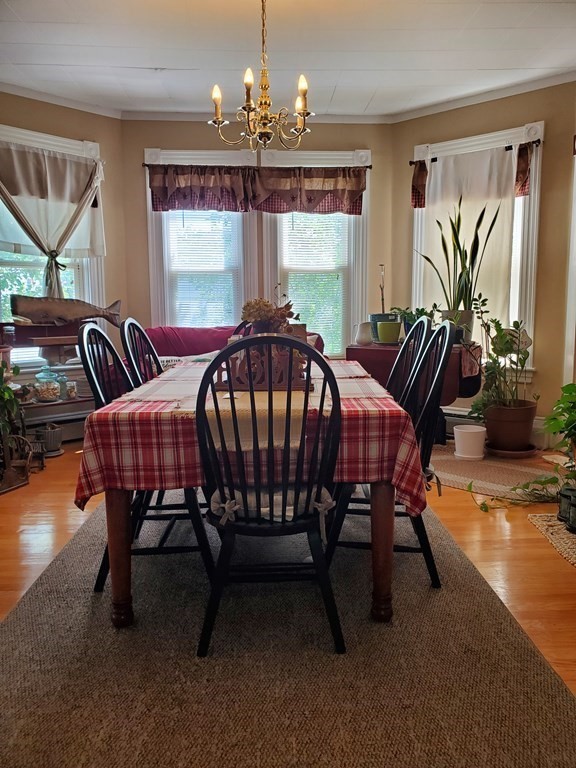 20 Baker Street Gardner, MA 01440 - Photo 2 of 15 a bedroom with a bed table closet and a window