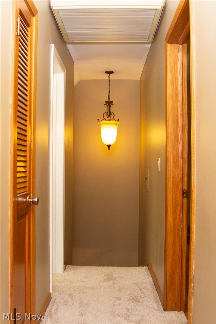 121 South Tamarack Road Akron, OH 44319 - Photo 23 of 35 2nd floor hallway with linen close, new carpet, and beautiful light fixture!