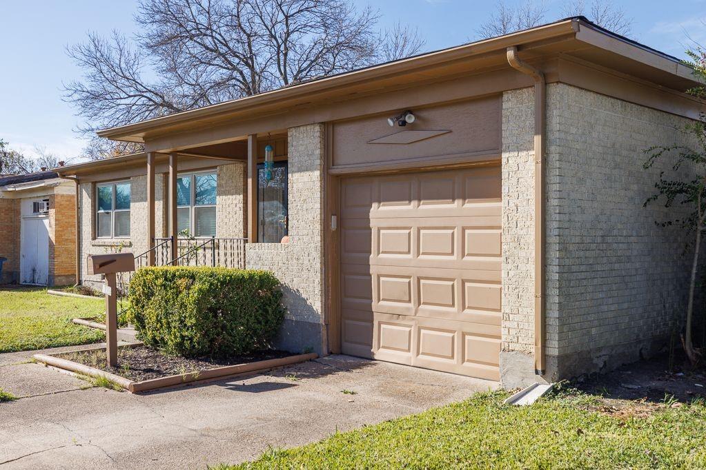 1723 Alhambra Street Dallas, TX 75217 - Photo 1 of 22 a view of a house with small yard and wooden fence