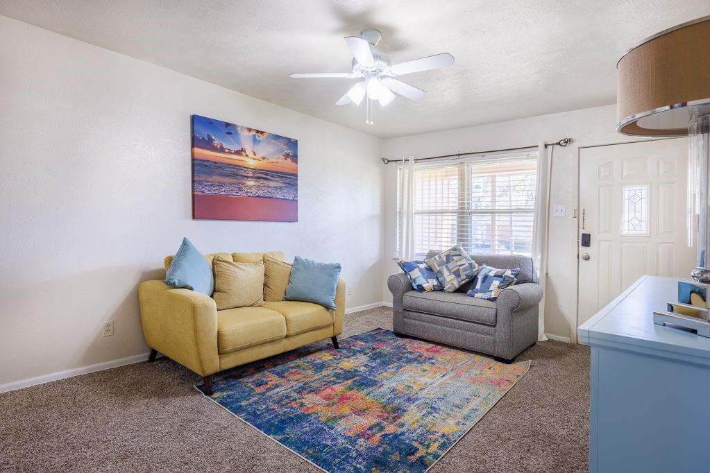 1723 Alhambra Street Dallas, TX 75217 - Photo 11 of 22 a living room with furniture and a couch