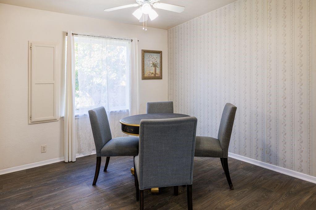 1723 Alhambra Street Dallas, TX 75217 - Photo 13 of 22 a view of a dining room with furniture window and wooden floor