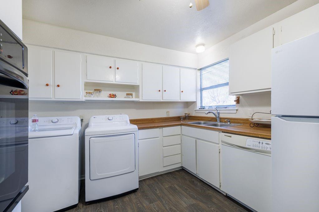 1723 Alhambra Street Dallas, TX 75217 - Photo 17 of 22 a kitchen with cabinets appliances a sink and a counter top space