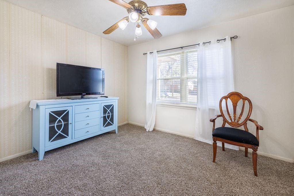 1723 Alhambra Street Dallas, TX 75217 - Photo 19 of 22 a living room with furniture and a flat screen tv