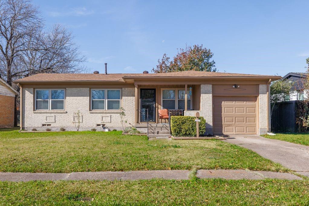 1723 Alhambra Street Dallas, TX 75217 - Photo 2 of 22 a front view of a house with a yard