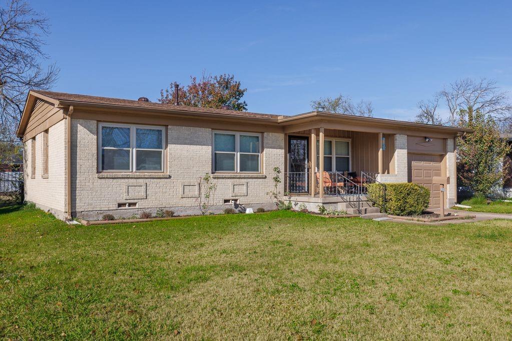 1723 Alhambra Street Dallas, TX 75217 - Photo 3 of 22 a view of a house with a yard and sitting area
