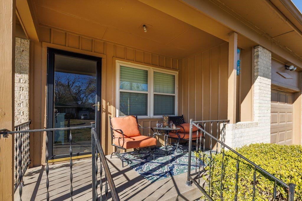 1723 Alhambra Street Dallas, TX 75217 - Photo 4 of 22 a balcony with furniture and outdoor view