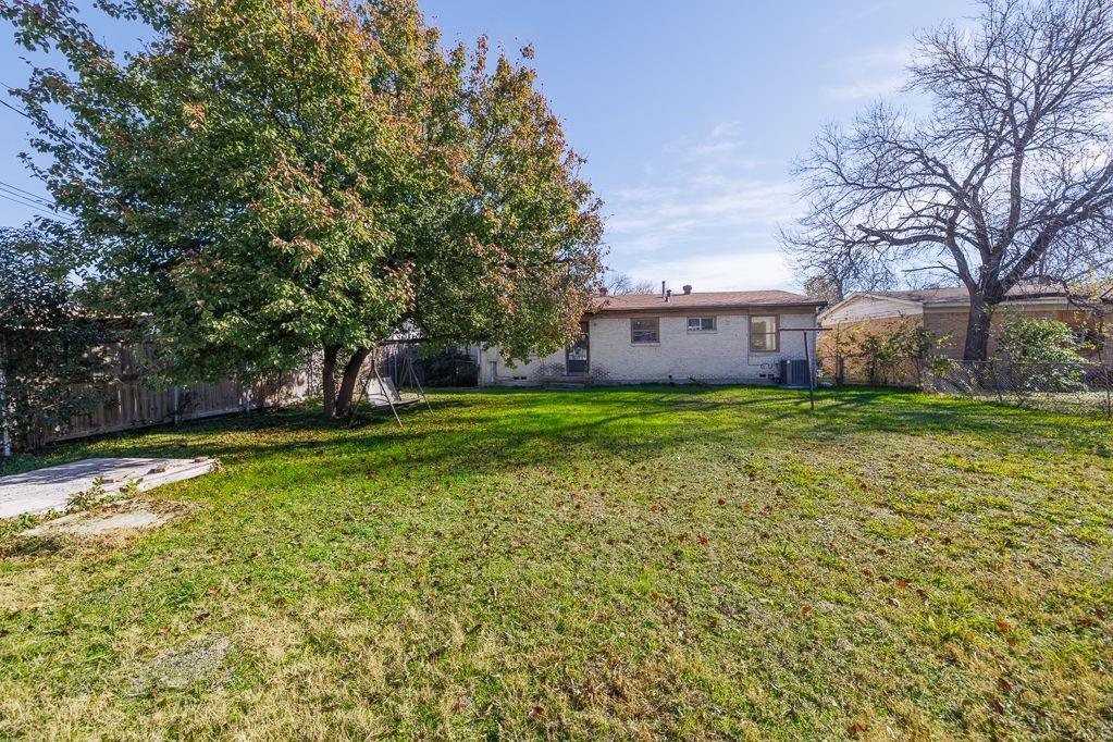 1723 Alhambra Street Dallas, TX 75217 - Photo 5 of 22 a view of a house with a yard