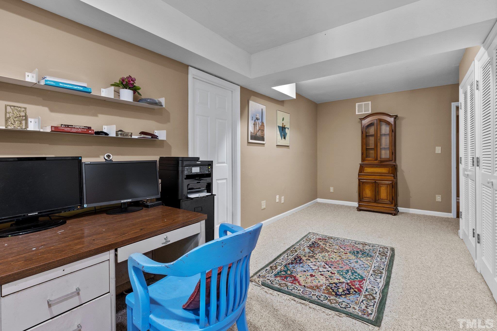 2516 Ashley Court Raleigh, NC 27607 - Photo 33 of 48 a bedroom with furniture and wooden floor