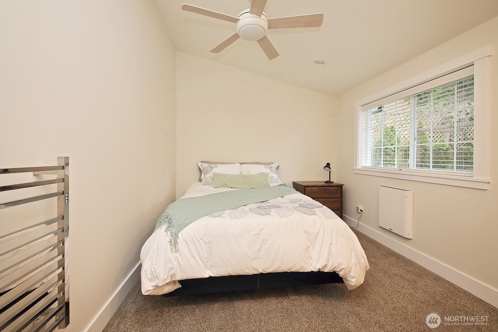 2999 Saratoga Road Langley, WA 98260 - Photo 23 of 40 a bedroom with a bed and window