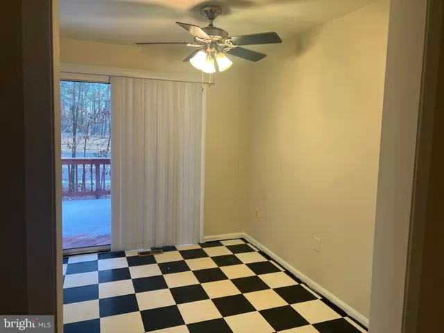 a black and white wall with a black white checkered floor